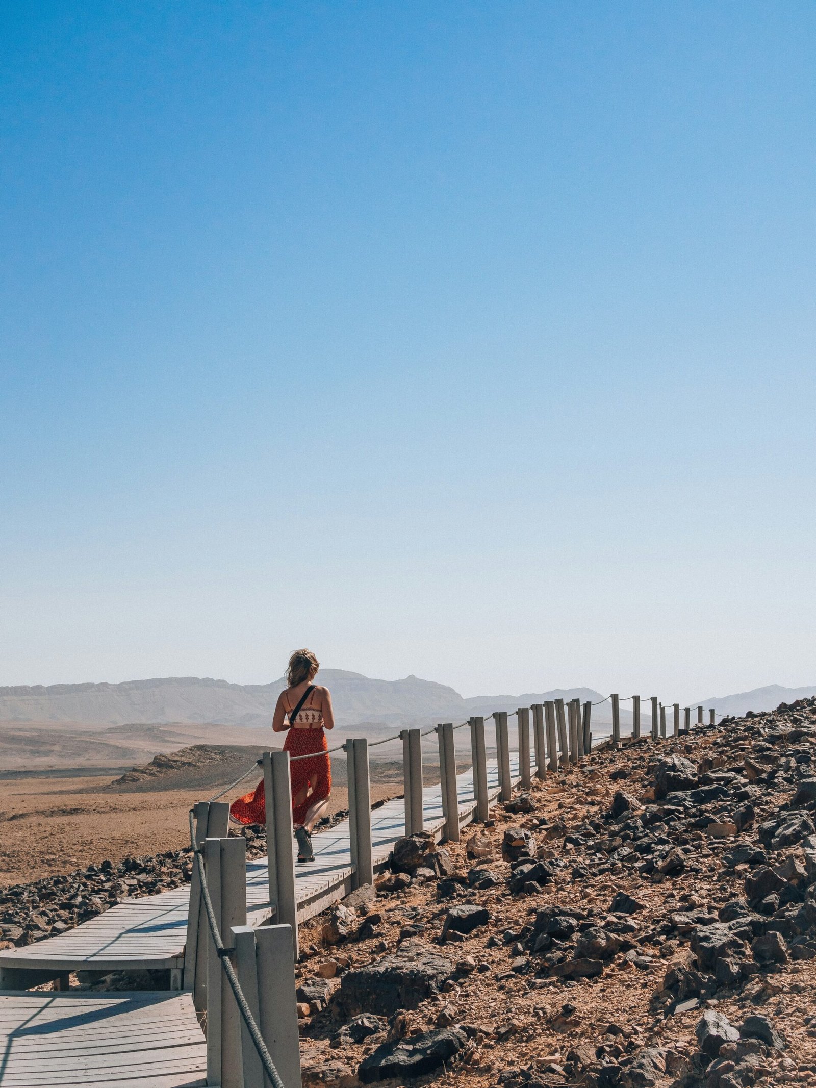 a person standing on a bridge